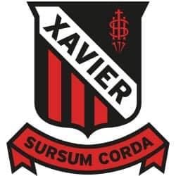 Home Xavier Meat Processing logo with shield and banner design for quality meat products.